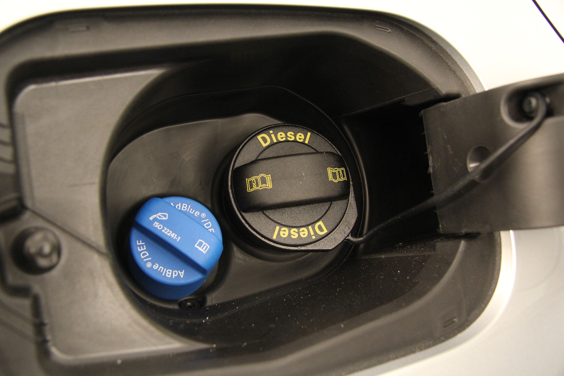 AdBlue urea tank lid next to the diesel tank lid