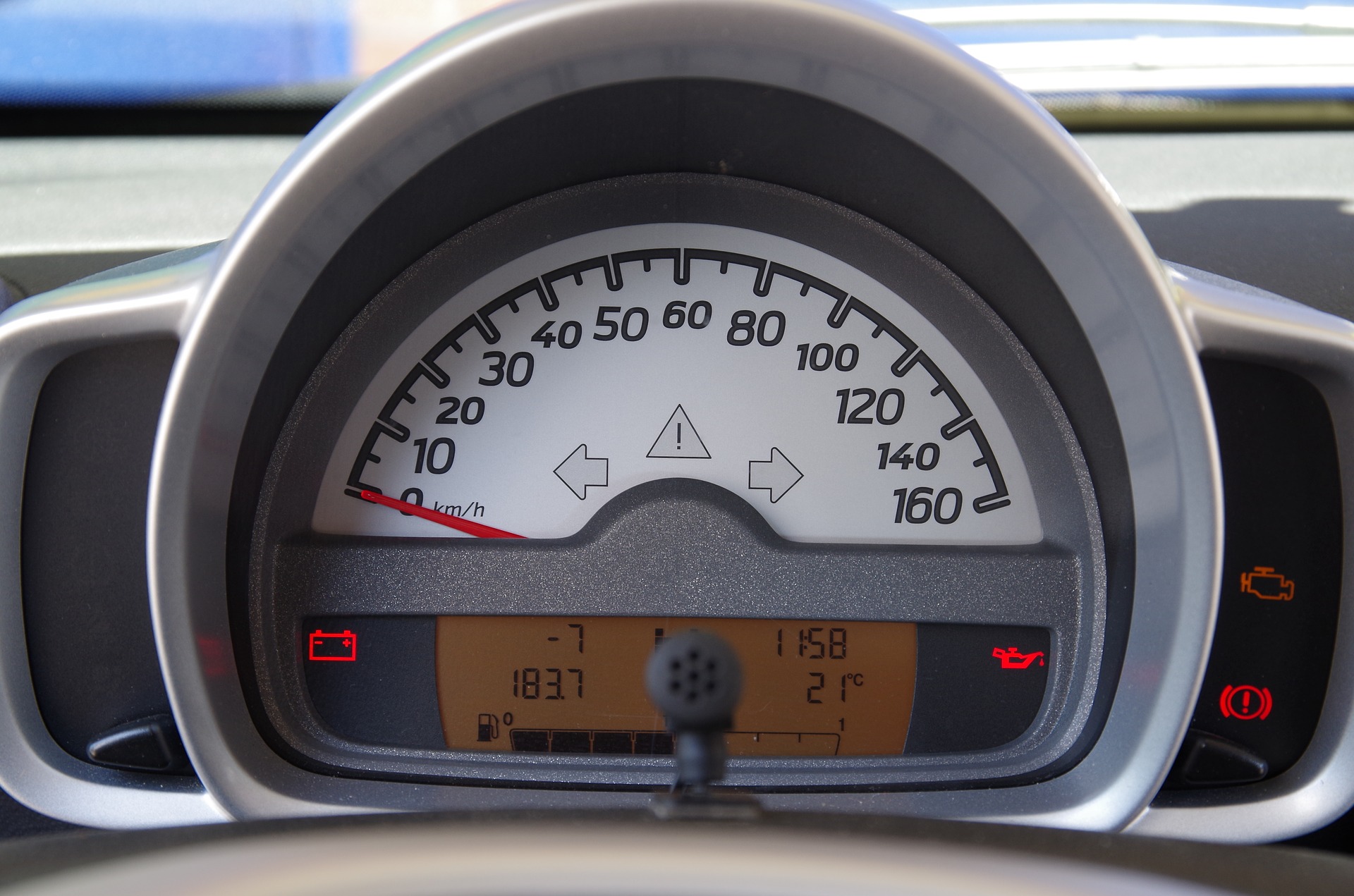 Partially illuminated indicator lights in the instrument panel of a car